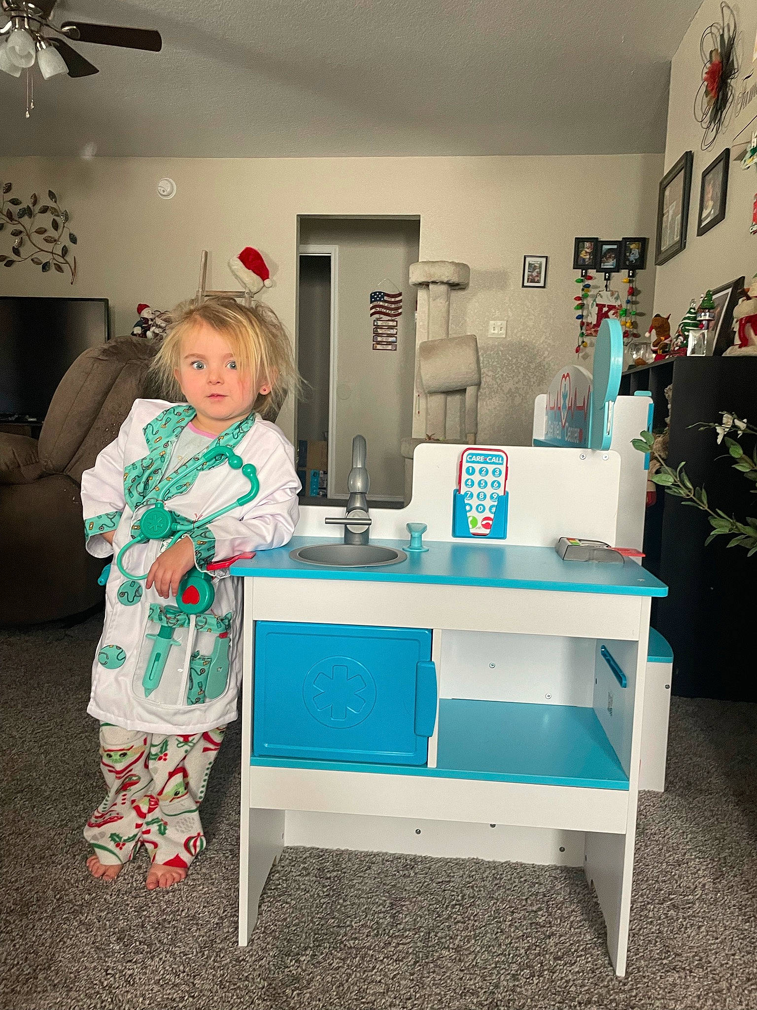 Kaydence is registered to the contest to win money with this photo: ceiling_fan, comfort, couch, desk, electric_blue, fashion_design, flooring, furniture, house, houseplant, interior_design, lamp, lighting, living_room, mechanical_fan, person, picture_frame, purple, rectangle, room