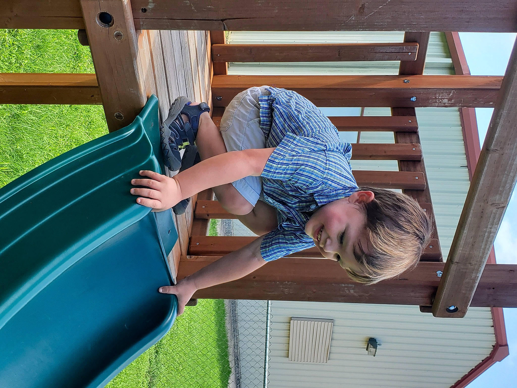 Garrett is registered to the contest to win money with this photo: child, chute, city, comfort, electric_blue, fun, grass, green, joy, leisure, outdoor_furniture, outdoor_play_equipment, person, photograph, playground_slide, recreation, shade, shorts, t_shirt, toddler