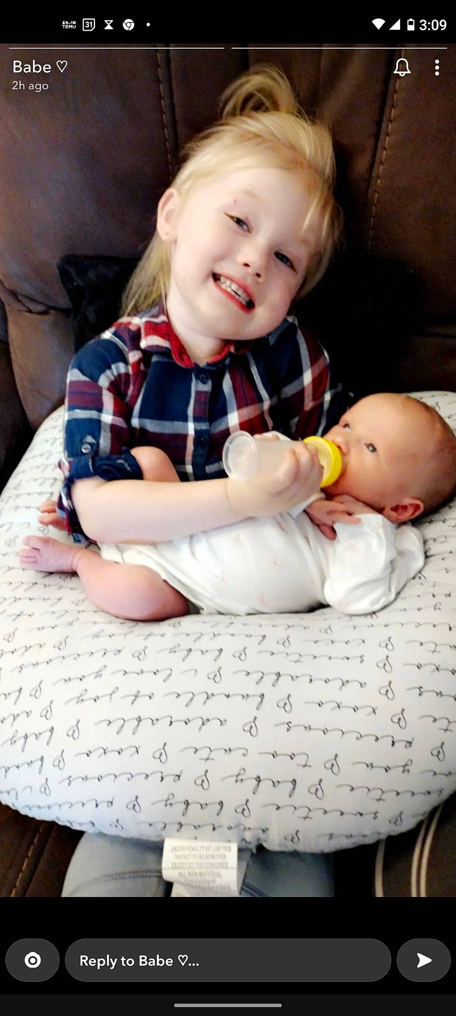 Summer is registered to the contest to win money with this photo: arm, baby, baby_toddler_clothing, cheek, child, comfort, eye, finger, hairstyle, hand, happy, human_body, joy, mouth, person, plaid, skin, sleeve, smile, tartan