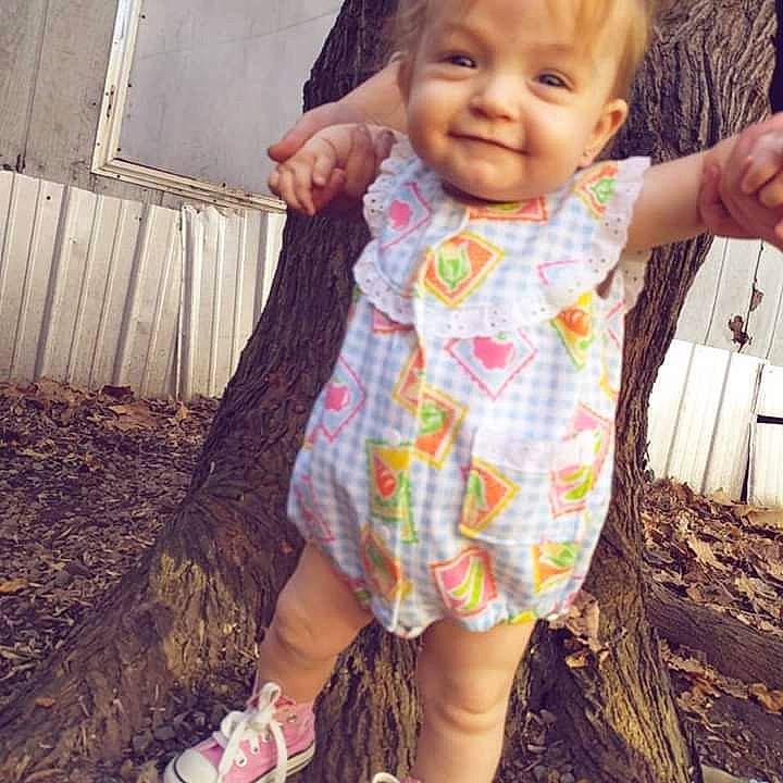 Skylar is registered to the contest to win money with this photo: child, design, girl, joy, long_hair, neck, outerwear, pattern, person, toddler