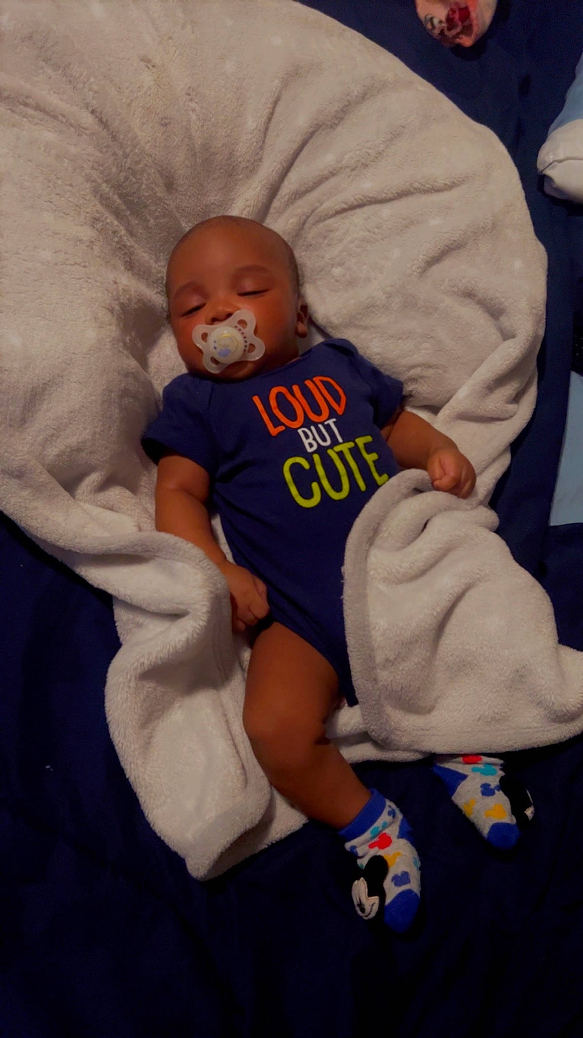 Zyon joined the competition — help win amazing prizes! baby, baby_products, baby_sleeping, baby_toddler_clothing, child, comfort, couch, electric_blue, finger, human_leg, knee, linens, person, room, sitting, sleeve, sportswear, t_shirt, textile, thigh