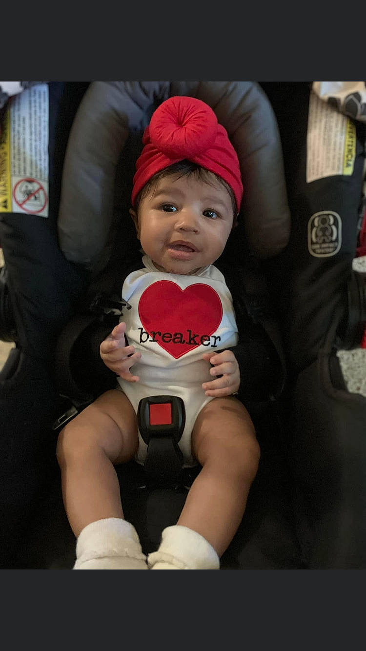 Kaliyah joined the competition — help win amazing prizes! baby, baby_carriage, baby_products, baby_safety, baby_toddler_clothing, beanie, cap, car_seat, carmine, cheek, child, comfort, fun, happy, headwear, knit_cap, lap, person, personal_protective_equipment, sitting