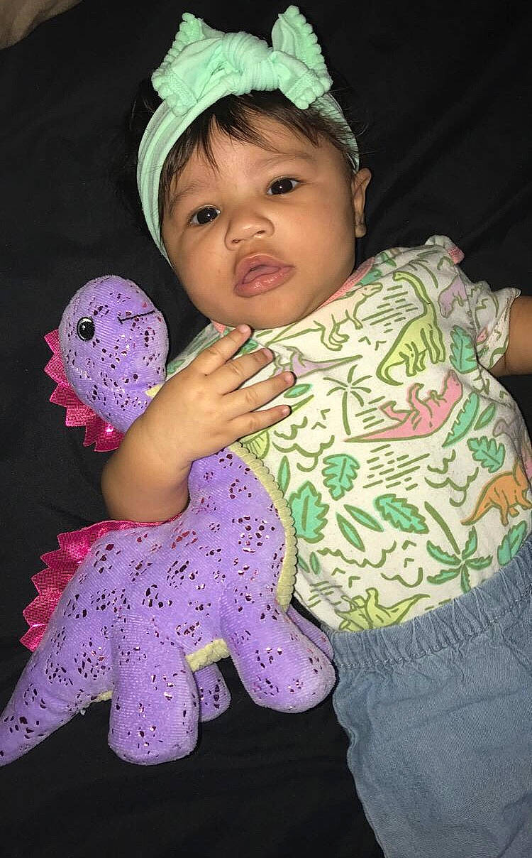 Kaliyah joined the competition — help win amazing prizes! baby, baby_products, baby_toddler_clothing, cap, cheek, child, eye, fashion_accessory, fun, happy, head, magenta, organ, pattern, person, pink, purple, skin, sleeve, textile