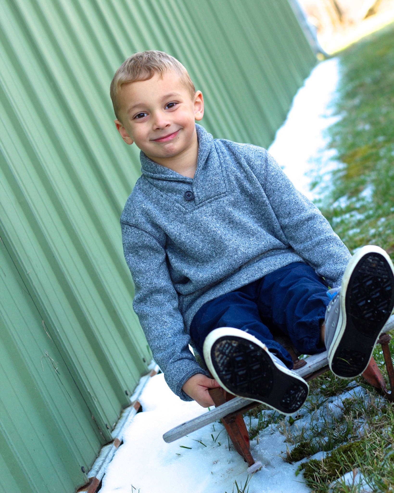 Nicholas is registered to the contest to win money with this photo: child, child_model, cool, footwear, happy, jeans, joy, leg, leisure, outerwear, person, photography, play, portrait_photography, recreation, shoe, sitting, smile, snow, toddler