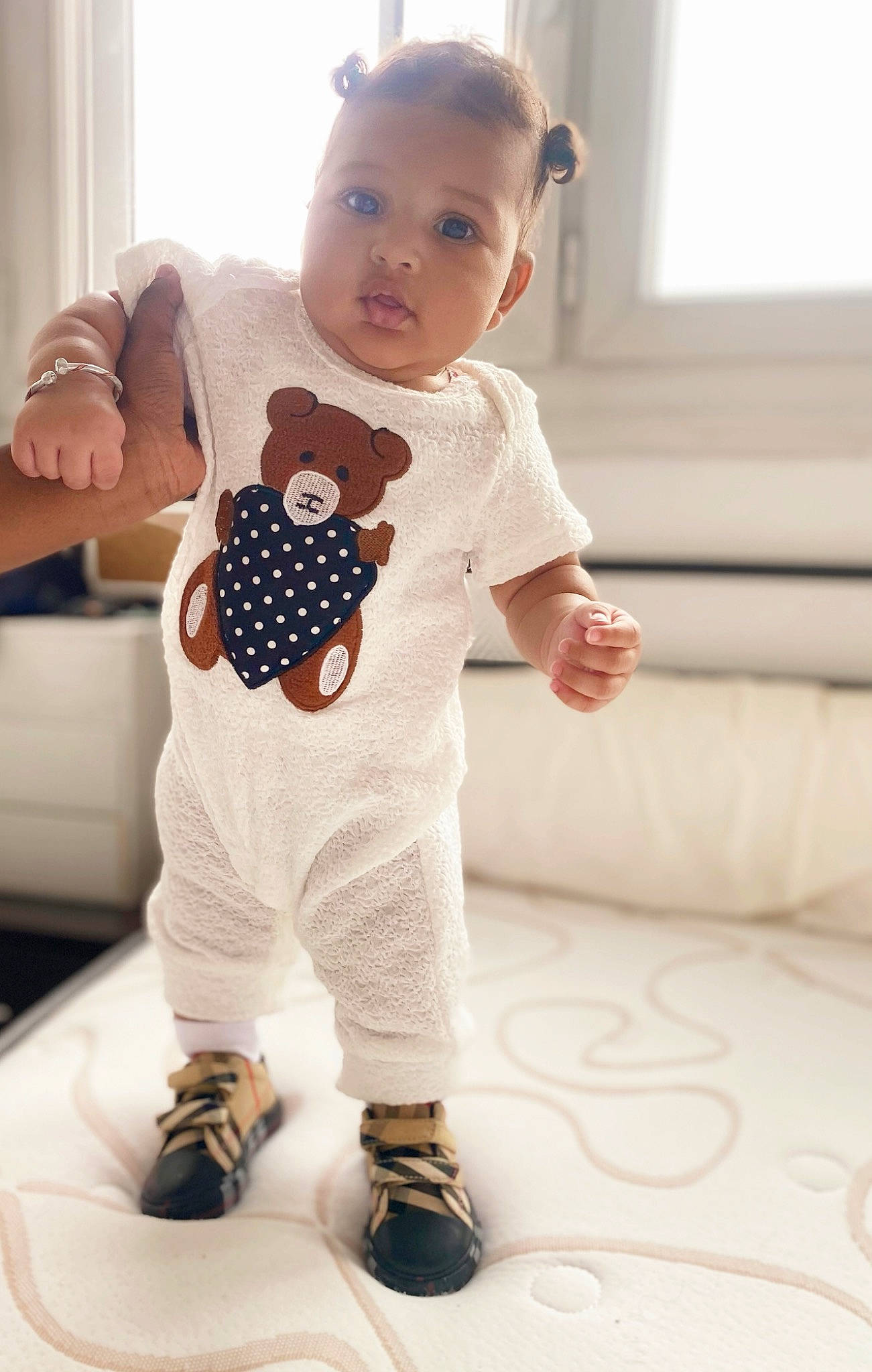 Inayah participe au concours pour gagner de l'argent avec cette photo : arm, baby, baby_toddler_clothing, child, finger, flooring, hand, happy, joint, outerwear, pattern, person, shoulder, sleeve, standing, stuffed_toy, t_shirt, textile, toddler, toy