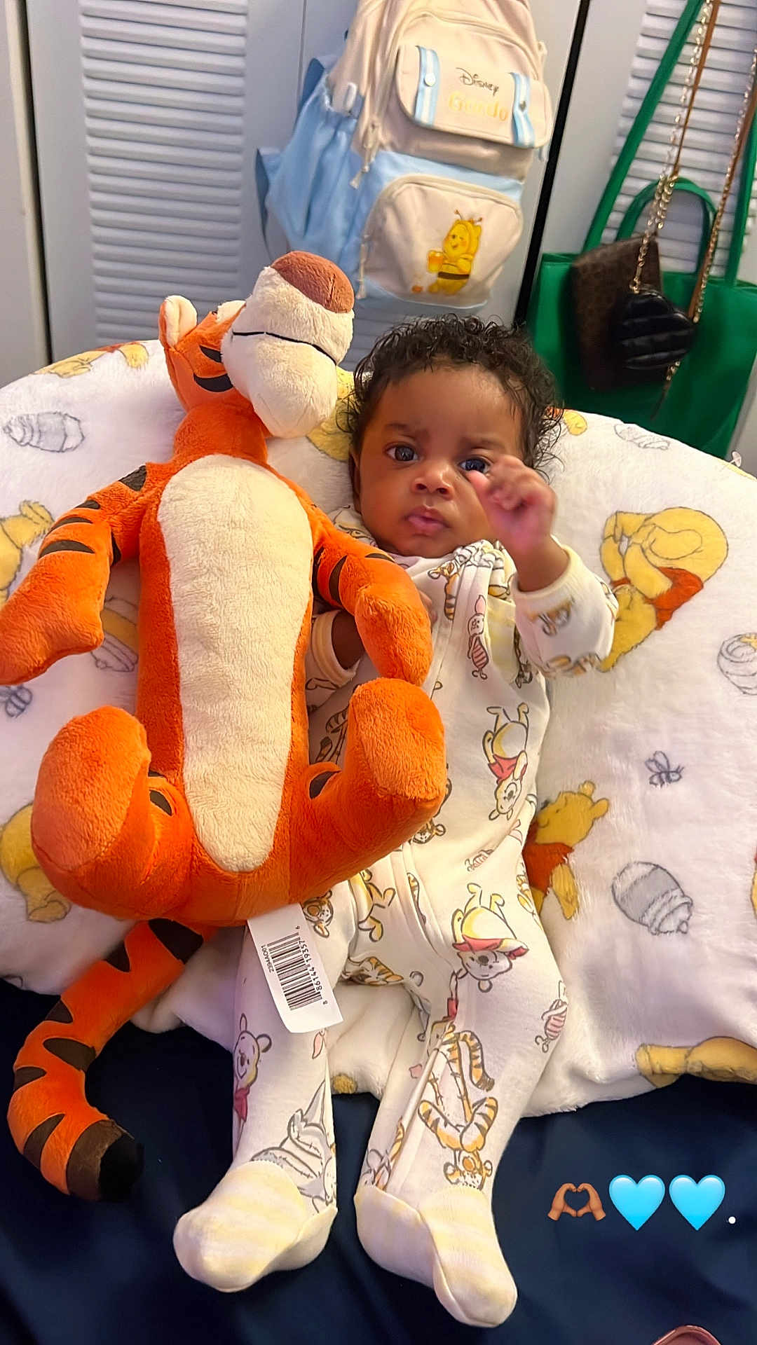 Malachi is registered to the contest to win money with this photo: baby, child, plush_toy, tigger, winnie_the_pooh, pajamas, blanket, bed, indoor, cute, infant, stuffed_animal, soft_toy, childrens_clothing, face, person, home, comfort, sleepwear, furniture