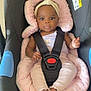 baby, child, car_seat, infant, headband, pink_cushion, seatbelt, safety, indoor, floor, clothing, cute, person, small_child, foot, hand, face, expression, toddler, baby_girl