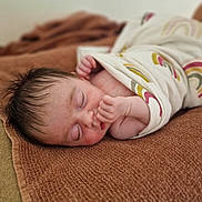 Agathe participe au concours pour gagner de l'argent avec cette photo : baby, blanket, child, closeup, cozy, cute, face, hand, indoors, infant, newborn, peaceful, portrait, rainbow_pattern, resting, skin, sleeping, soft_texture, towel, wrapped