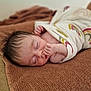 baby, blanket, child, closeup, cozy, cute, face, hand, indoors, infant, newborn, peaceful, portrait, rainbow_pattern, resting, skin, sleeping, soft_texture, towel, wrapped