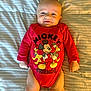 baby, bed, bedroom, clothing, cushion, face, furniture, happy, head, homedecor, indoors, newborn, person, photography, portrait, room, shirt, shorts, sitting, t_shirt