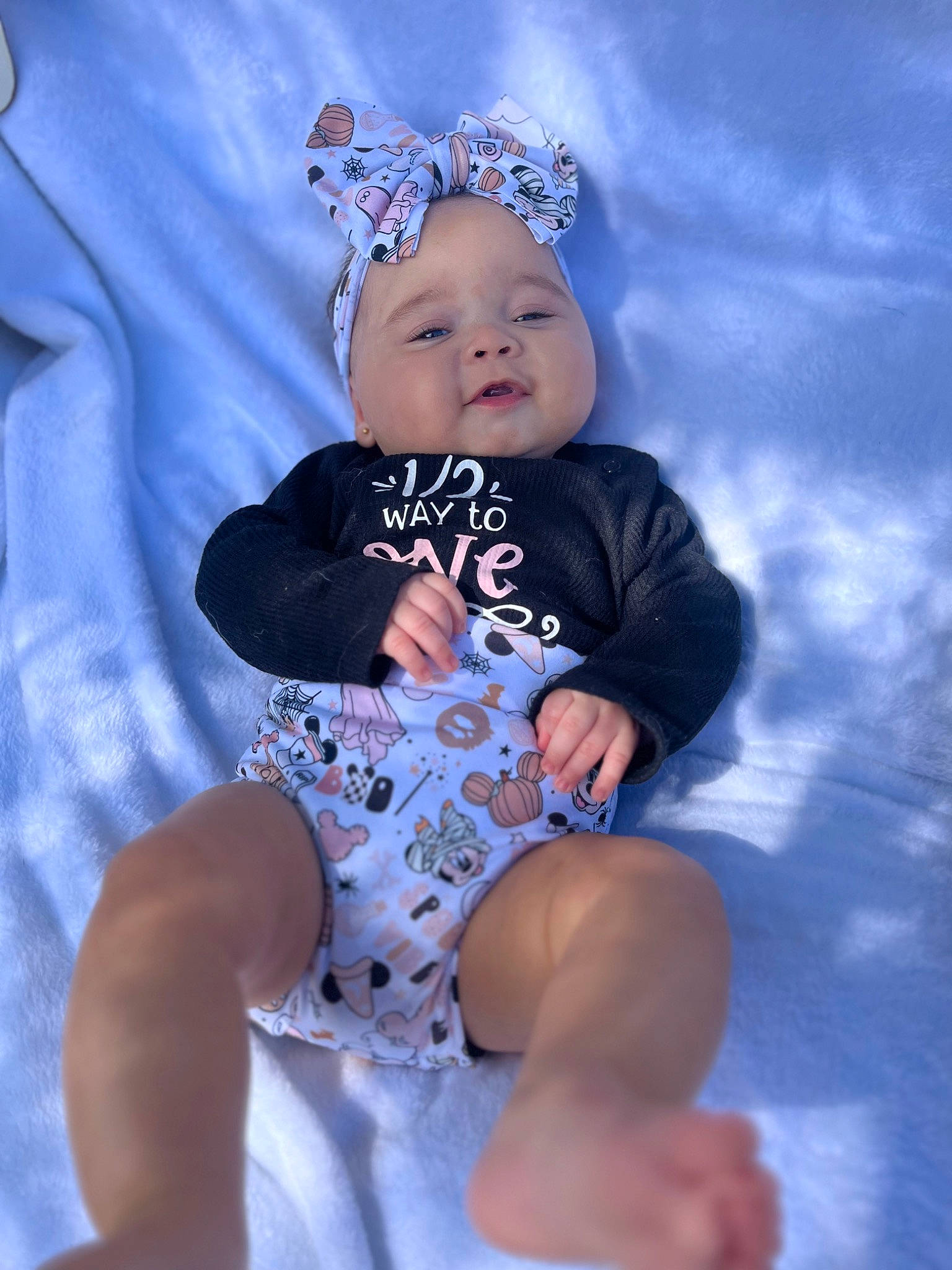 Amelia is registered to the contest to win money with this photo: baby, baby_toddler_clothing, costume_hat, electric_blue, fashion_accessory, flash_photography, fun, happy, hat, headgear, headwear, human_body, human_leg, pattern, person, pink, purple, shorts, sleeve, thigh