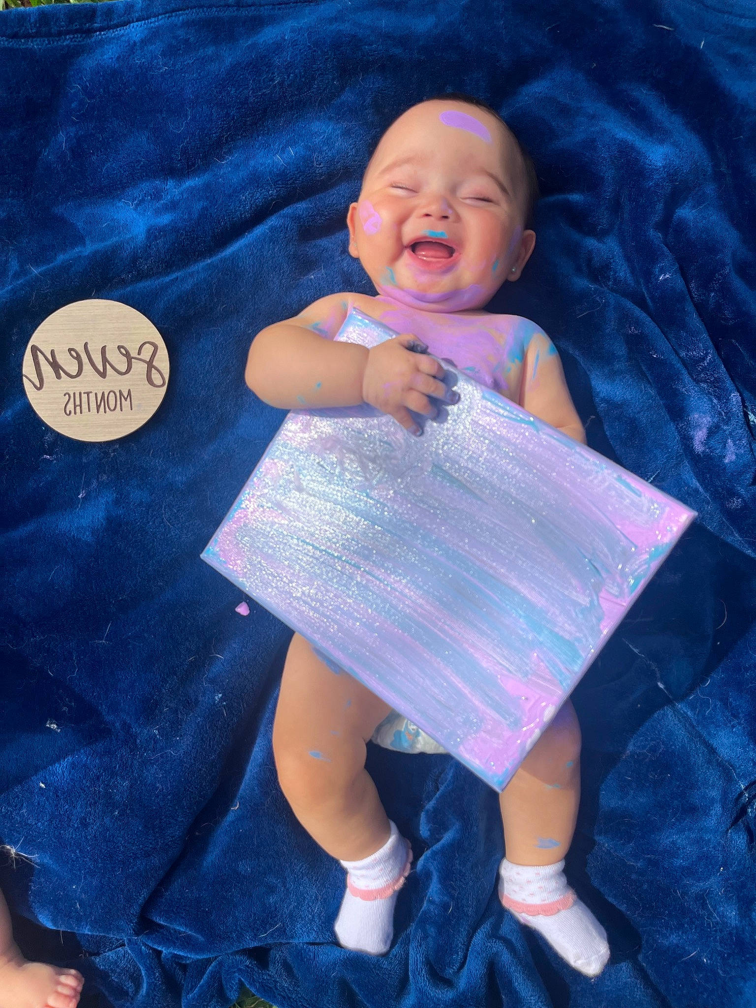 Amelia joined the competition — help win amazing prizes! azure, baby, baby_products, baby_toddler_clothing, child, electric_blue, fashion_accessory, happy, linens, magenta, pattern, person, pink, purple, sleeve, smile, sock, t_shirt, textile, toddler
