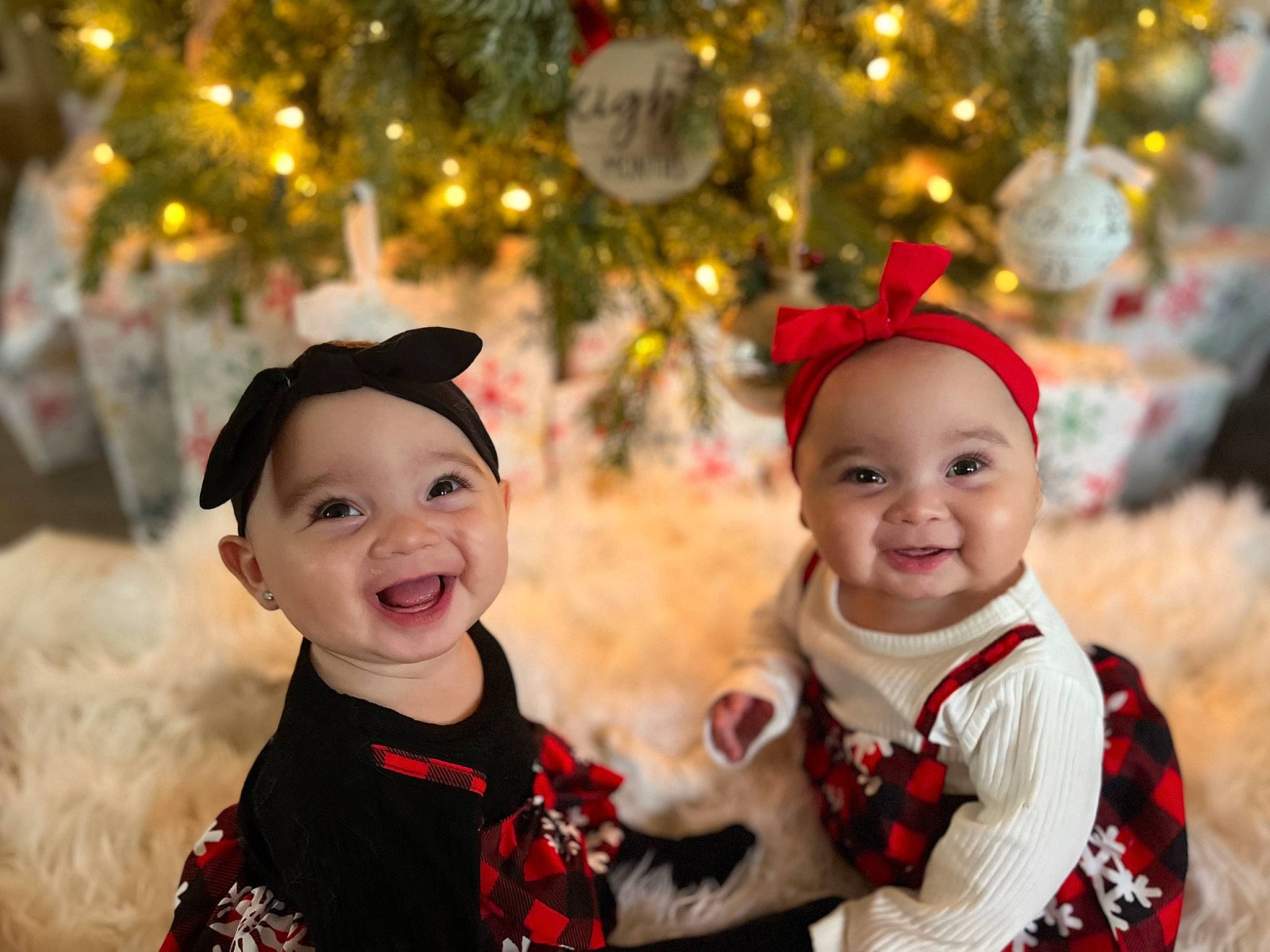 Amelia joined the competition — help win amazing prizes! baby, child, christmas, christmas_ornament, christmas_tree, event, eye, face, facial_expression, fun, happy, head, headwear, human, human_body, joy, organ, person, smile, snapshot