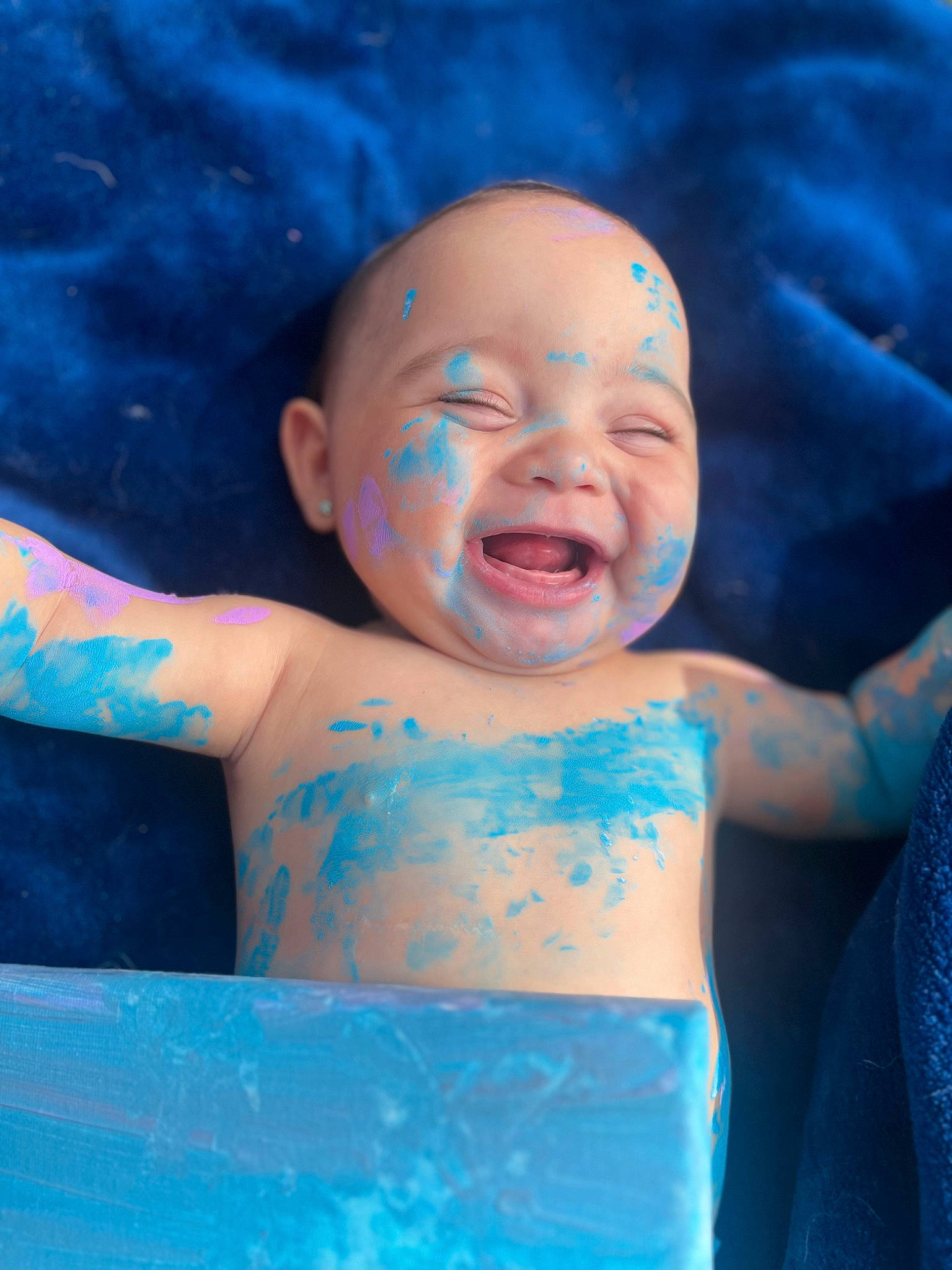 Everly is registered to the contest to win money with this photo: arm, azure, baby, blue, child, eye, facial_expression, finger, fun, gesture, happy, human_body, iris, leisure, mouth, person, pink, product, skin, smile