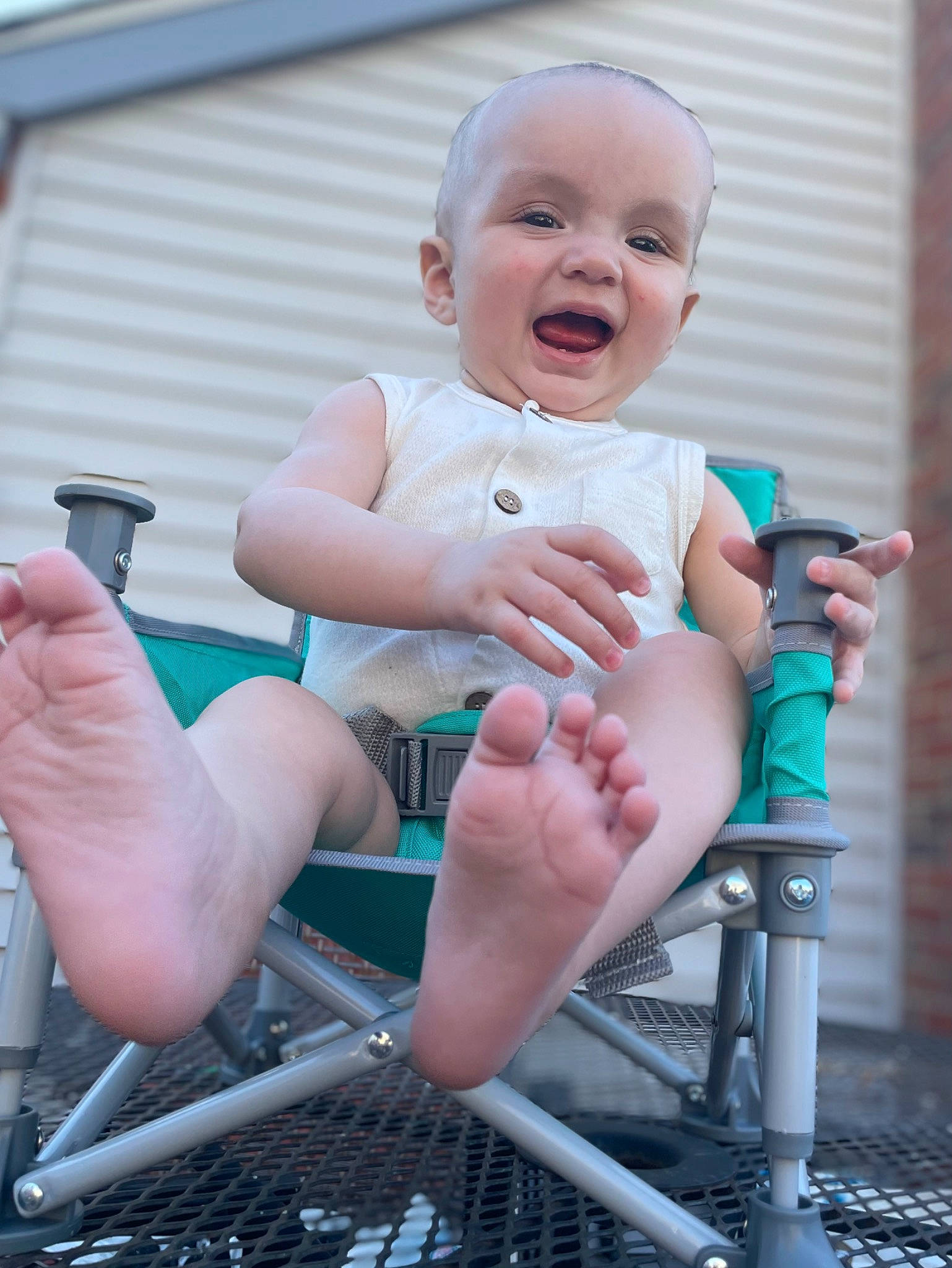 Kendrick is registered to the contest to win money with this photo: baby, baby_products, baby_toddler_clothing, child, finger, foot, fun, hand, happy, human_body, human_leg, leg, leisure, person, shorts, sitting, skin, smile, thigh, thumb