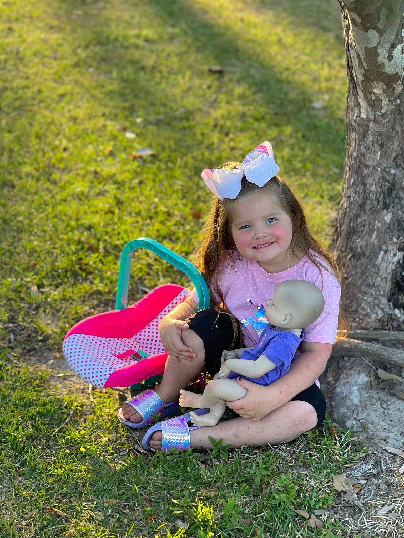 Lila joined the competition — help win amazing prizes! footwear, fun, grass, grassland, happy, joy, leg, leisure, mammal, meadow, natural_environment, people_in_nature, person, pink, plant, shoe, smile, sneakers, summer, toddler