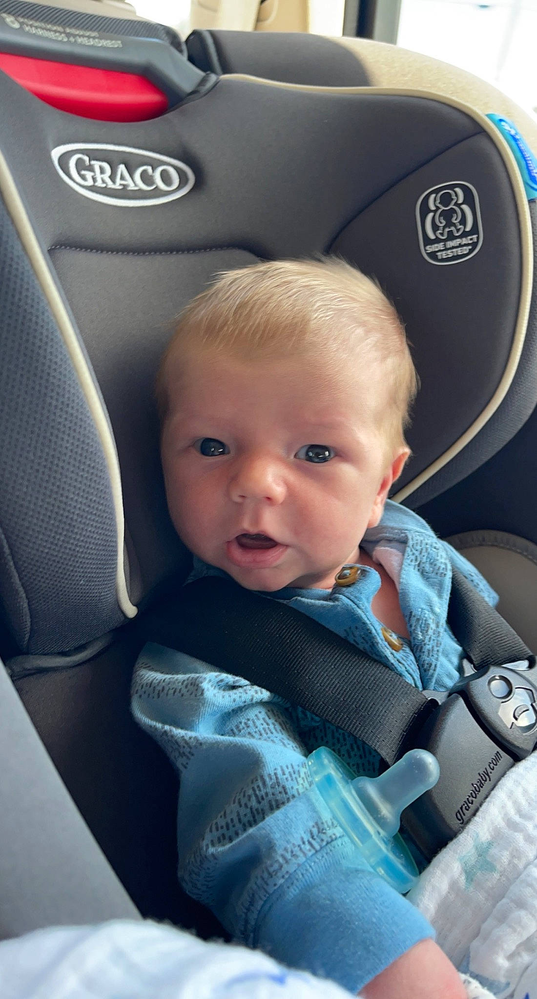 Leighton is registered to the contest to win money with this photo: auto_part, automotive_design, automotive_tire, automotive_wheel_system, baby, baby_products, baby_toddler_clothing, car_seat, car_seat_cover, child, comfort, electric_blue, family_car, head_restraint, luxury_vehicle, motor_vehicle, person, personal_luxury_car, seat_belt, toddler