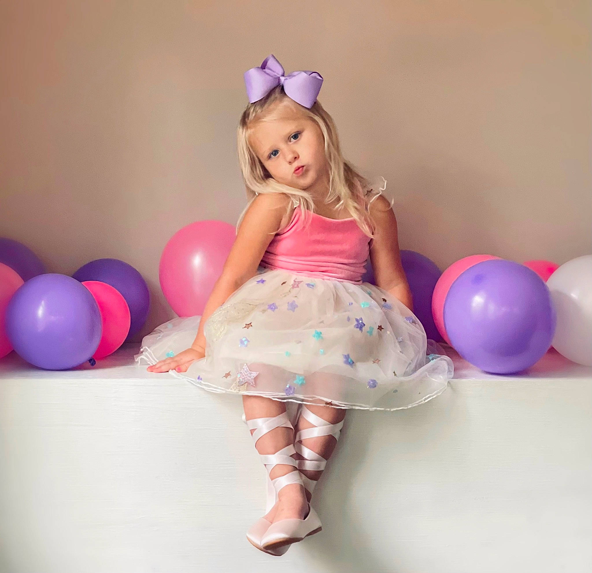 Presleigh is registered to the contest to win money with this photo: arm, baby_toddler_clothing, balloon, blond, child, doll, fun, hairstyle, happy, leg, magenta, party_supply, pattern, person, pink, product, skin, textile, thigh, toddler