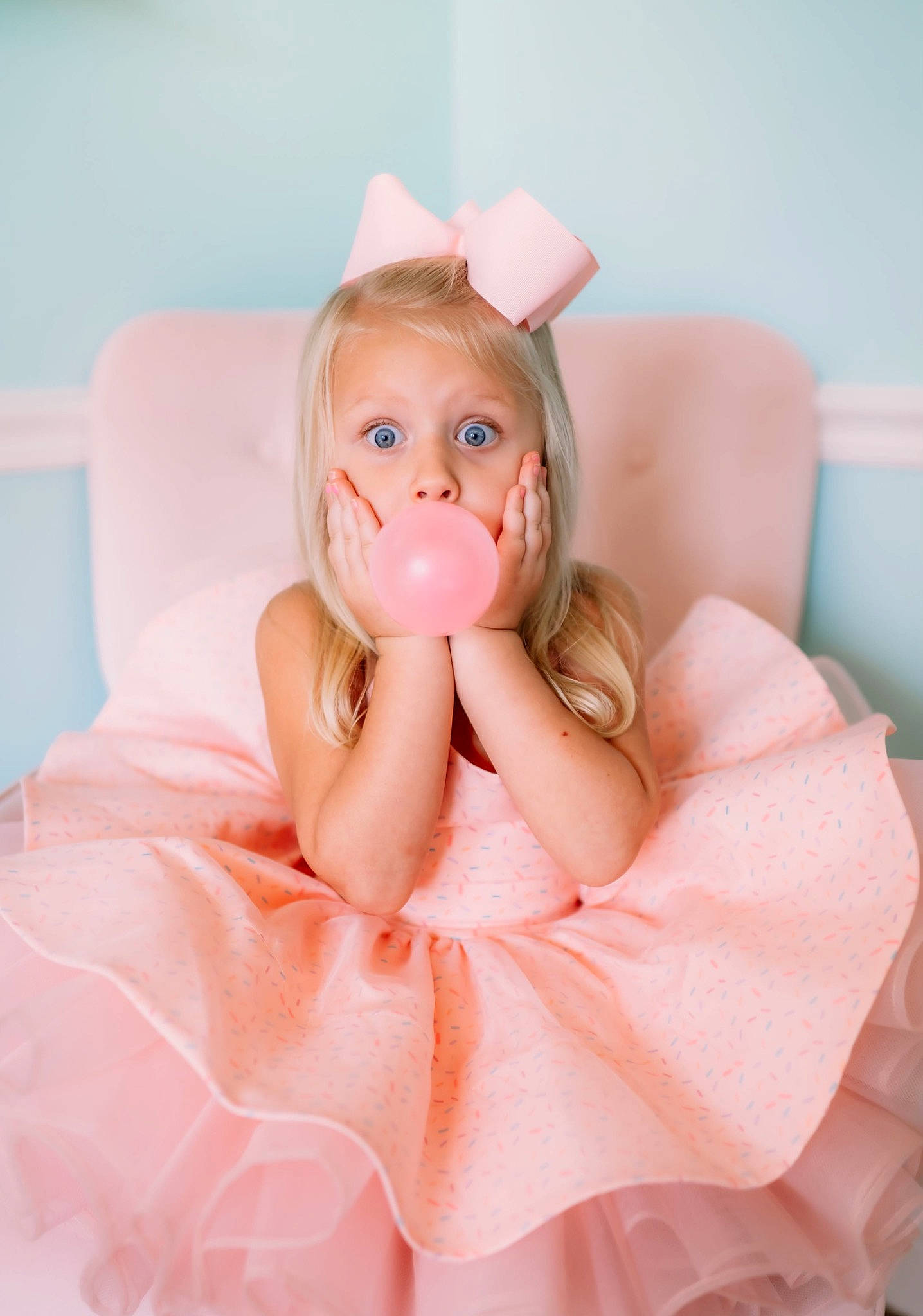 Presleigh is registered to the contest to win money with this photo: arm, baby_toddler_clothing, bathing, brown_hair, child, doll, eyelash, fashion_accessory, hand, lip, long_hair, nail, neck, peach, person, pink, sitting, tableware, textile, thumb