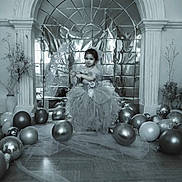 Ella a rejoint le concours — aidez-le/la à gagner de superbes lots ! child, toddler, balloons, dress, gown, party, celebration, indoor, floor, reflection, arch, decor, vase, flowers, curtain, portrait, smile, person, tulle, shiny