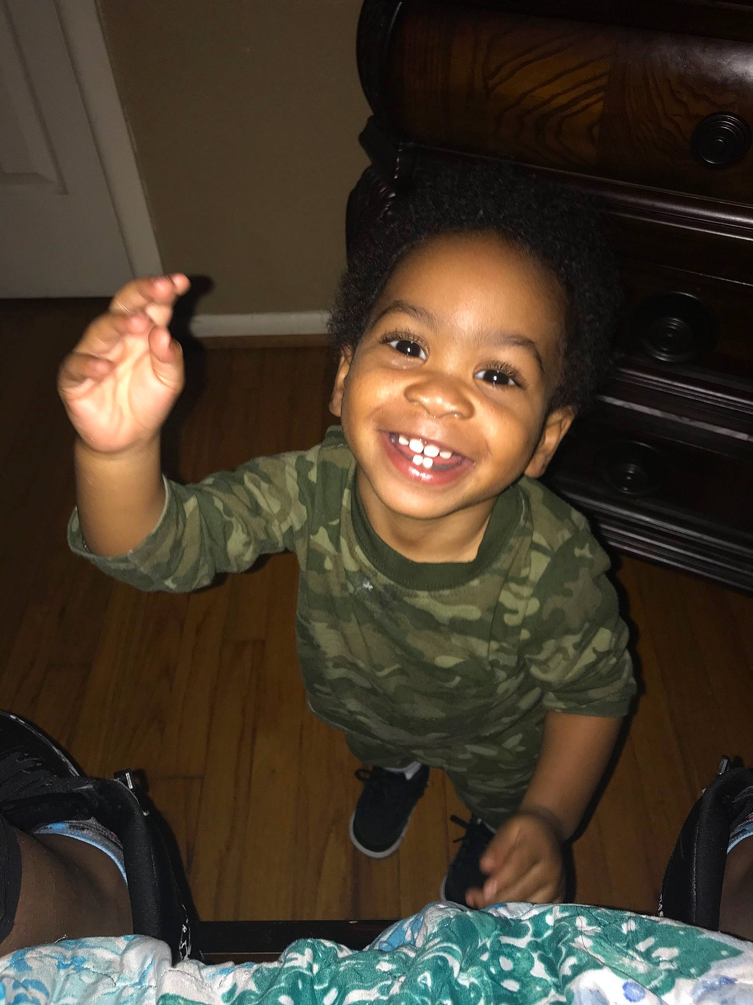 Isiah is registered to the contest to win money with this photo: cheek, child, eye, finger, fun, gesture, joy, laugh, organ, person, sitting, smile, toddler, tooth