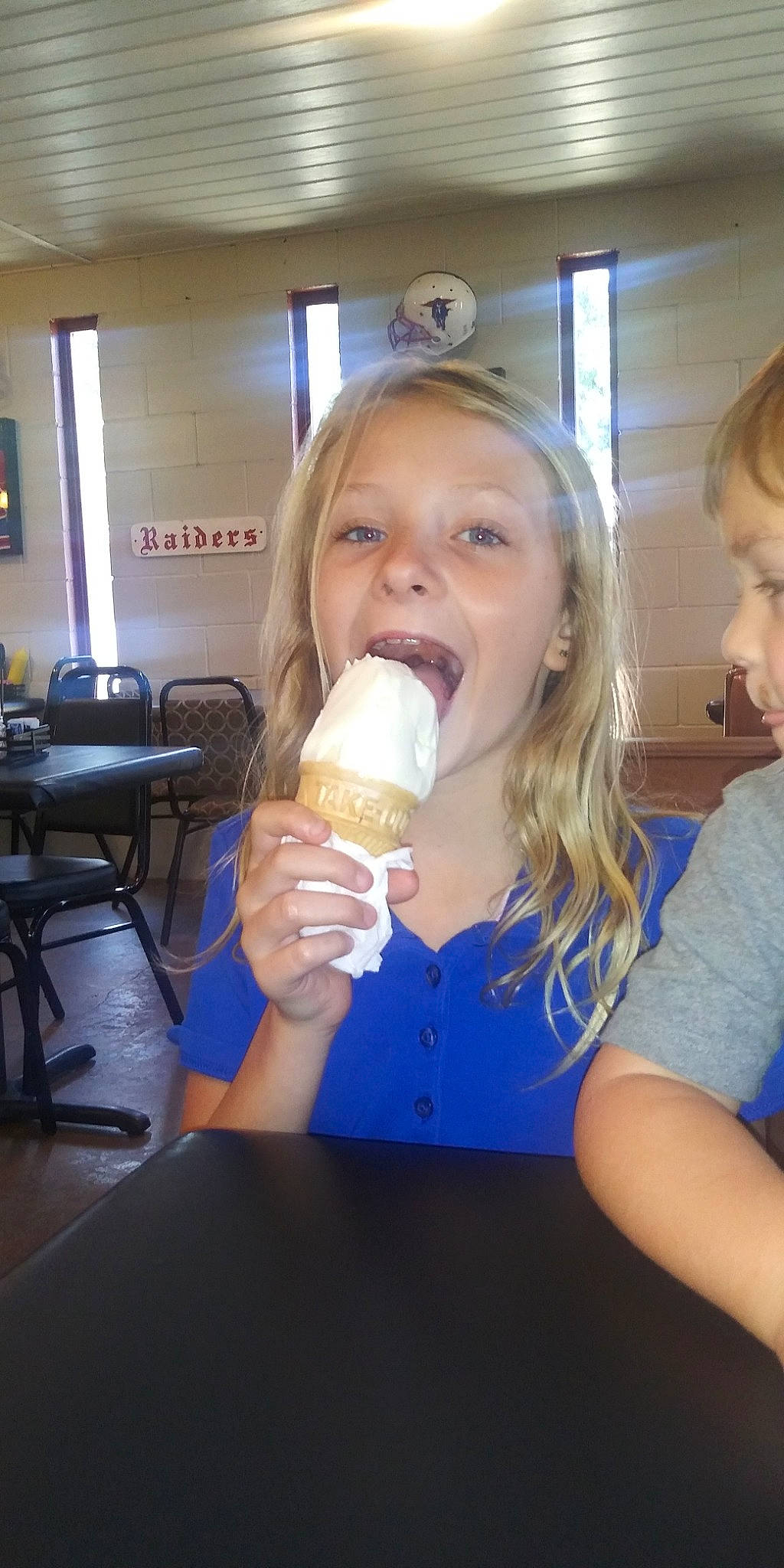 Leila is registered to the contest to win money with this photo: child, dairy, drink, drinking, food, ice_cream, mouth, person, plastic_bottle, water