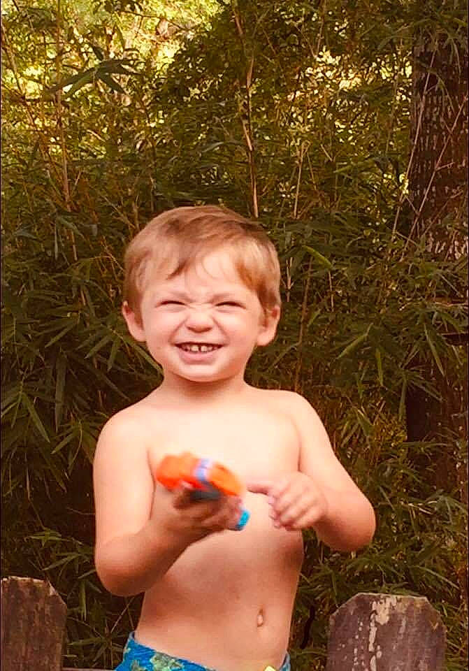 Ezekiel is registered to the contest to win money with this photo: abdomen, barechested, child, finger, fun, happy, joy, male, muscle, navel, person, play, smile, summer, toddler, tree, trunk, vacation