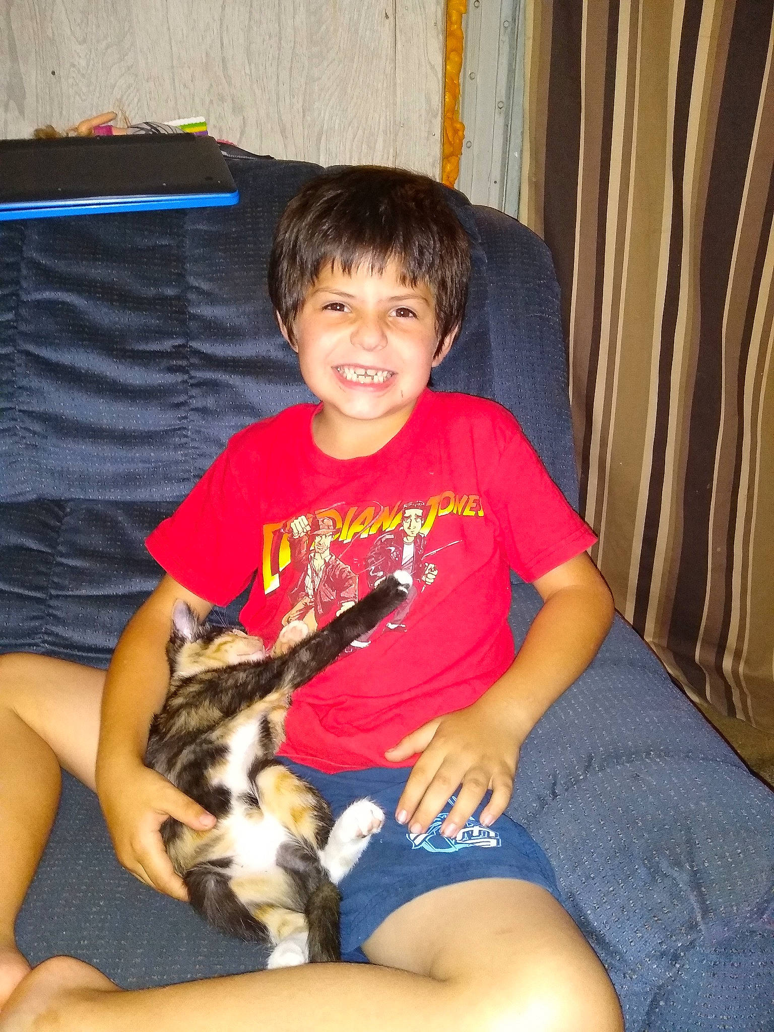 Faelen is registered to the contest to win money with this photo: canidae, carnivore, child, companion_dog, dog, dog_breed, fawn, joy, lap, leg, person, play, sitting, sporting_group