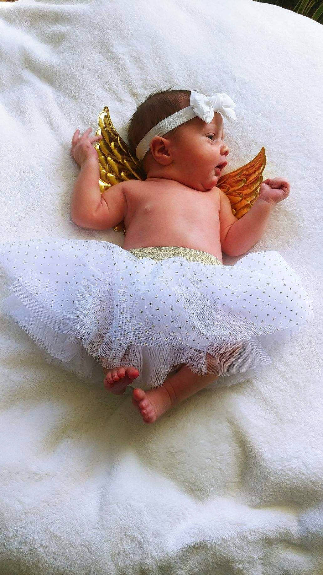 Luella joined the competition — help win amazing prizes! baby, baby_sleeping, baby_toddler_clothing, bridal_accessory, cap, comfort, dress, embellishment, finger, flash_photography, happy, headband, headgear, headpiece, headwear, human_leg, jewellery, leg, linens, person