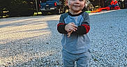 Sawyer joined the competition — help win amazing prizes! backyard, boots, child, face_paint, gravel, gray_clothing, happy, outdoor, photography, play, playground, portrait, smiling, standing, sunlight, toddler, toy_train, trees, truck, young_child