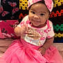 apparel, baby, butterfly_pillow, child, clothing, colorful_background, crocheted_blanket, cute, cuteness, girl, happy, headband, indoors, infant, person, pink_tutu, portrait, sitting, smiling, toddler