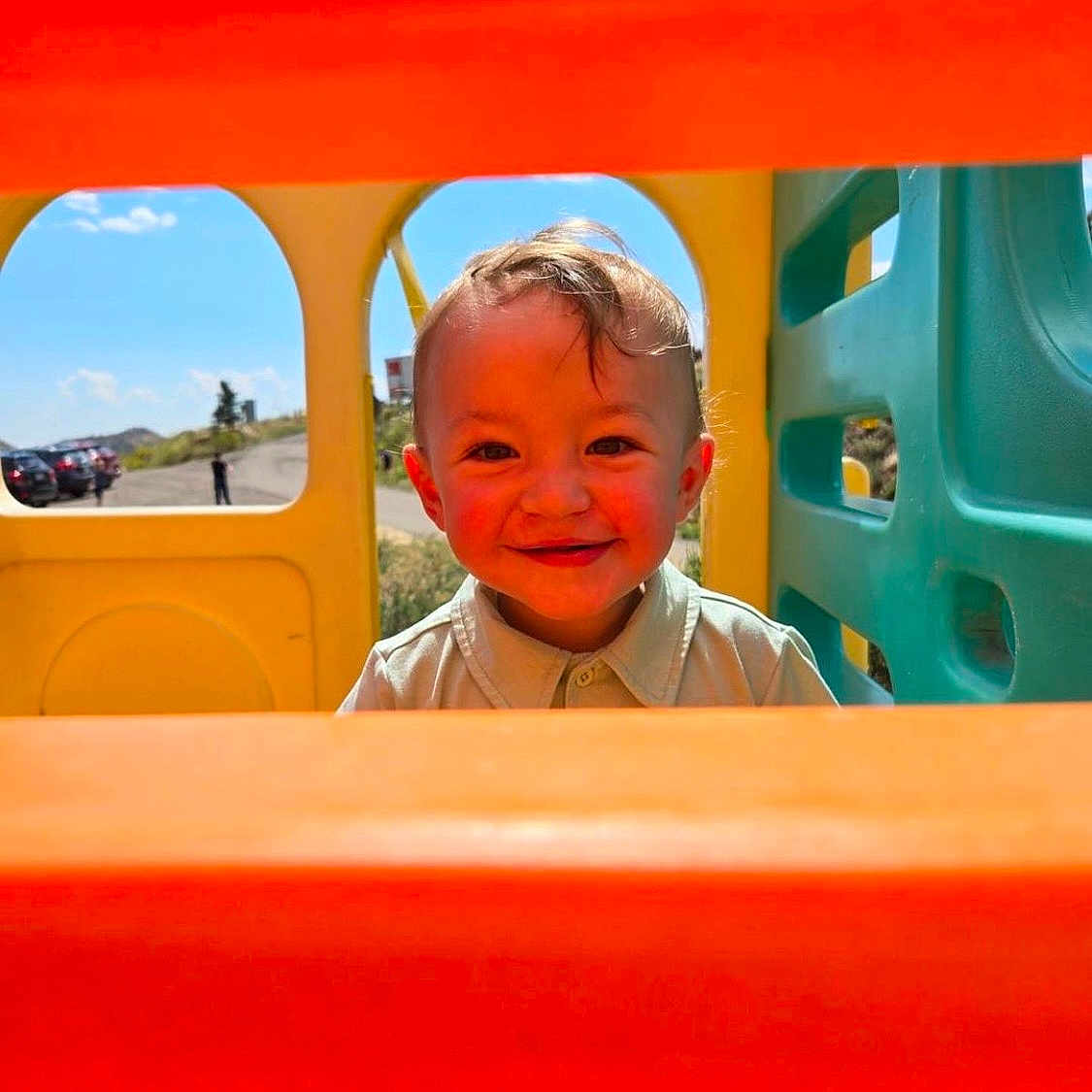 Nolan is registered to the contest to win money with this photo: baby, car, clothing, face, grass, happy, head, nature, outdoorplayarea, outdoors, park, person, photography, plant, playarea, portrait, smile, t_shirt, transportation, vehicle