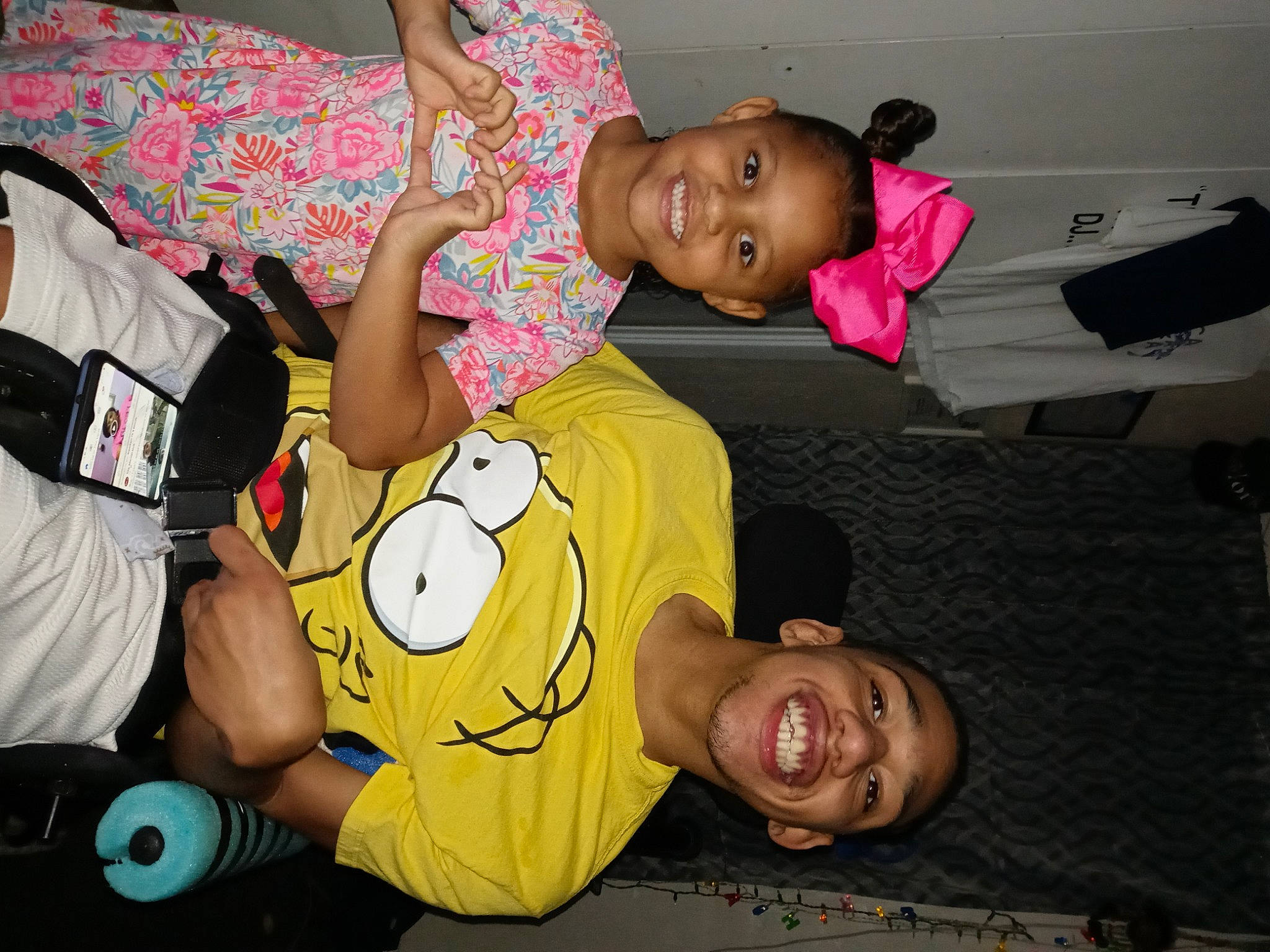 Mariyah is registered to the contest to win money with this photo: baby_toddler_clothing, child, comfort, elbow, event, facial_expression, fun, happy, joy, leisure, mouth, muscle, organ, party, person, room, shorts, smile, t_shirt, thigh