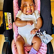 Bethel joined the competition — help win amazing prizes! baby, car_seat, infant, smile, white_onesie, purple_socks, bandage, pink_blanket, happy, tongue_out, indoor, wooden_floor, cloth, cute, child, person, seat, comfort, closeup, adorable