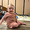 baby, casual, child, clothing, cute, expression, floor, happy, indoor, infant, person, playmat, portrait, room, sitting, smiling, toddler, toy, wooden_floor, young_child