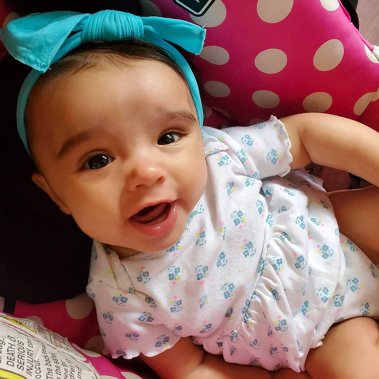 Joanna is registered to the contest to win money with this photo: baby, baby_toddler_clothing, beauty, cheek, child, ear, eye, face, facial_expression, hair_accessory, head, headgear, lip, mouth, nose, person, pink, skin, smile, textile