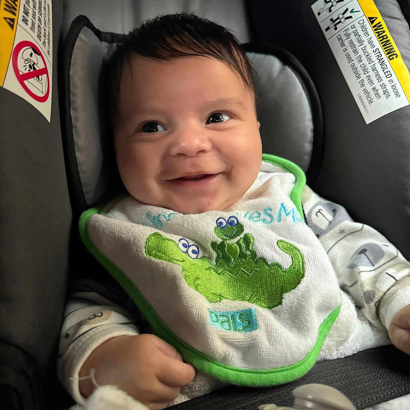 Julian joined the competition — help win amazing prizes! baby, bib, bodypart, car, car_interior, carseat, cushion, face, finger, hand, head, homedecor, newborn, person, photography, portrait, sitting, text, transportation, vehicle