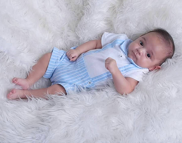 Sergio is registered to the contest to win money with this photo: arm, baby, baby_toddler_clothing, child, comfort, eye, fur, grass, happy, head, iris, linens, pattern, person, portrait_photography, sitting, skin, sleeve, textile, toddler
