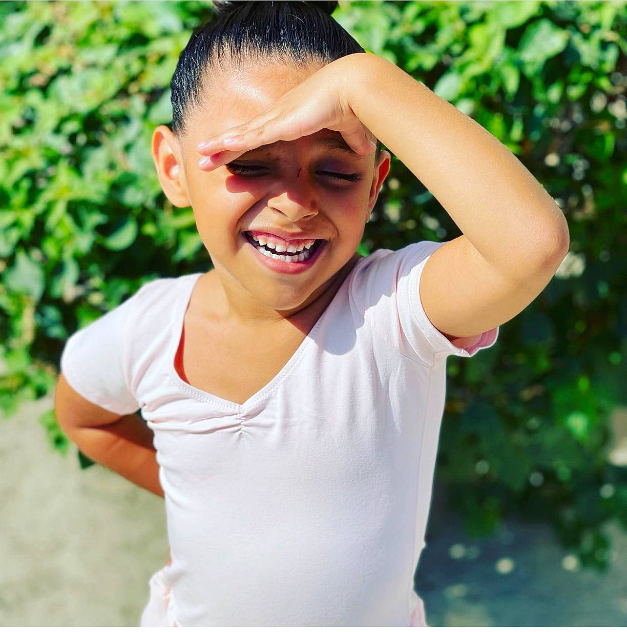 Rosie is registered to the contest to win money with this photo: chest, child, eyewear, facial_expression, fun, gesture, grass, happy, headpiece, jewellery, joy, leisure, lip, necklace, people_in_nature, person, recreation, sleeve, smile, sunglasses