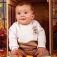 Liam participe au concours pour gagner de l'argent avec cette photo : baby, child, autumn_leaves, wooden_crate, sweater, cute, smiling, indoor, fall, seasonal, cozy, clothing, socks, portrait, happy, person, floor, decor, cute_baby, season