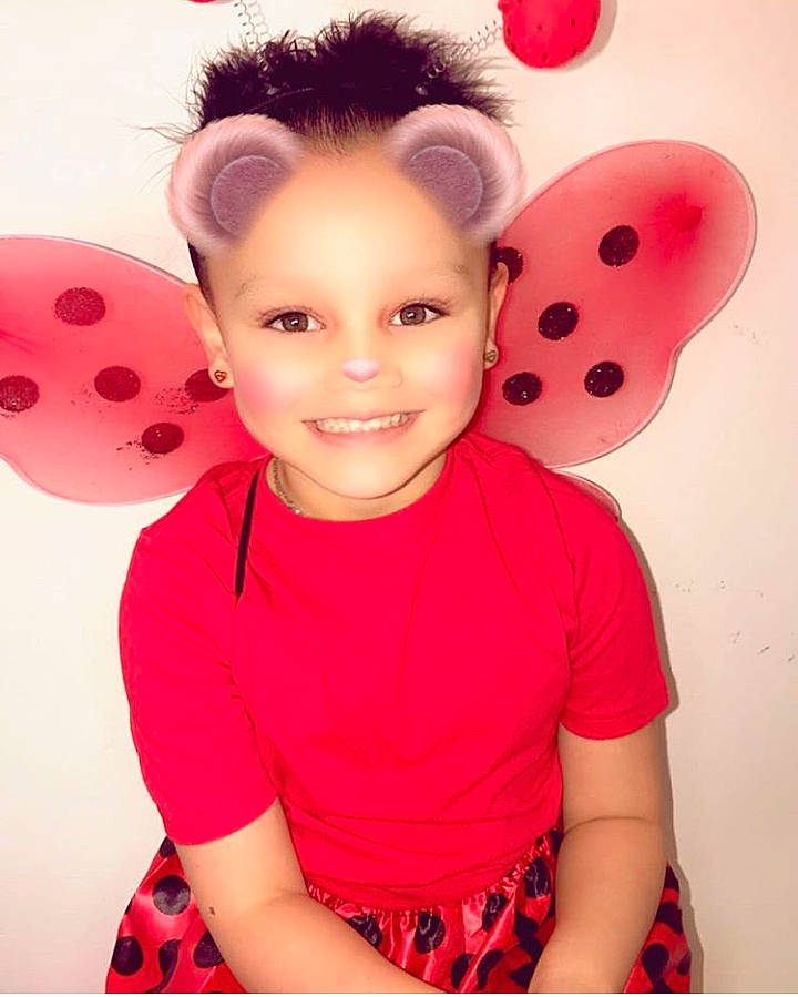 Breanna joined the competition — help win amazing prizes! baby_toddler_clothing, black_hair, child, chin, costume, ear, eyelash, happy, headgear, joy, lip, magenta, neck, nose, pattern, person, pink, red, sleeve, smile