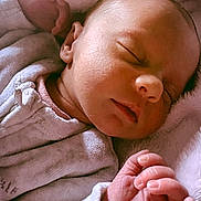 Liana Joy is registered to the contest to win money with this photo: newborn, baby, sleeping, infant, face, hand, fingers, blanket, clothing, soft, peaceful, closeup, portrait, cute, skin, rest, cozy, child, young, relax