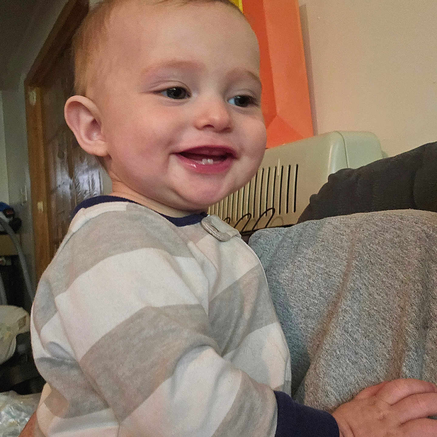 Lincoln joined the competition — help win amazing prizes! baby, babylaughing, bodypart, clothing, couch, cushion, face, finger, furniture, hand, happy, head, homedecor, indoors, laughing, person, photography, portrait, sitting, smile