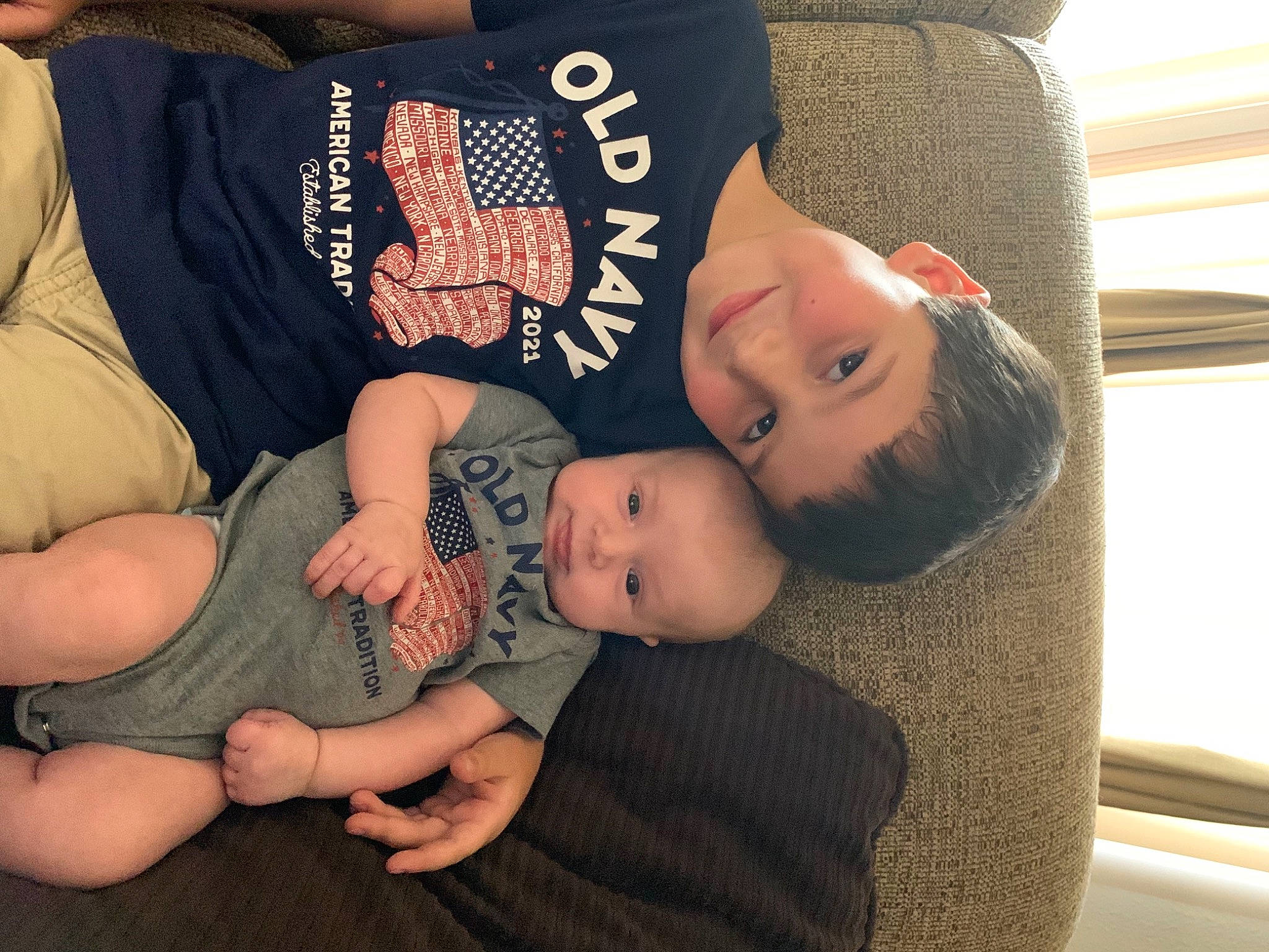 Wyatt is registered to the contest to win money with this photo: abdomen, arm, baby, baby_toddler_clothing, child, comfort, elbow, finger, gesture, happy, human_leg, joy, lap, nail, person, sitting, sleeve, t_shirt, thigh, toddler
