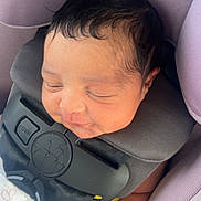 Ahziyla is registered to the contest to win money with this photo: baby, blanket, car_seat, child, closeup, clothing, comfort, cute, face, hair, hand, infant, newborn, peaceful, purple, resting, safety_harness, seatbelt, sleeping, soft