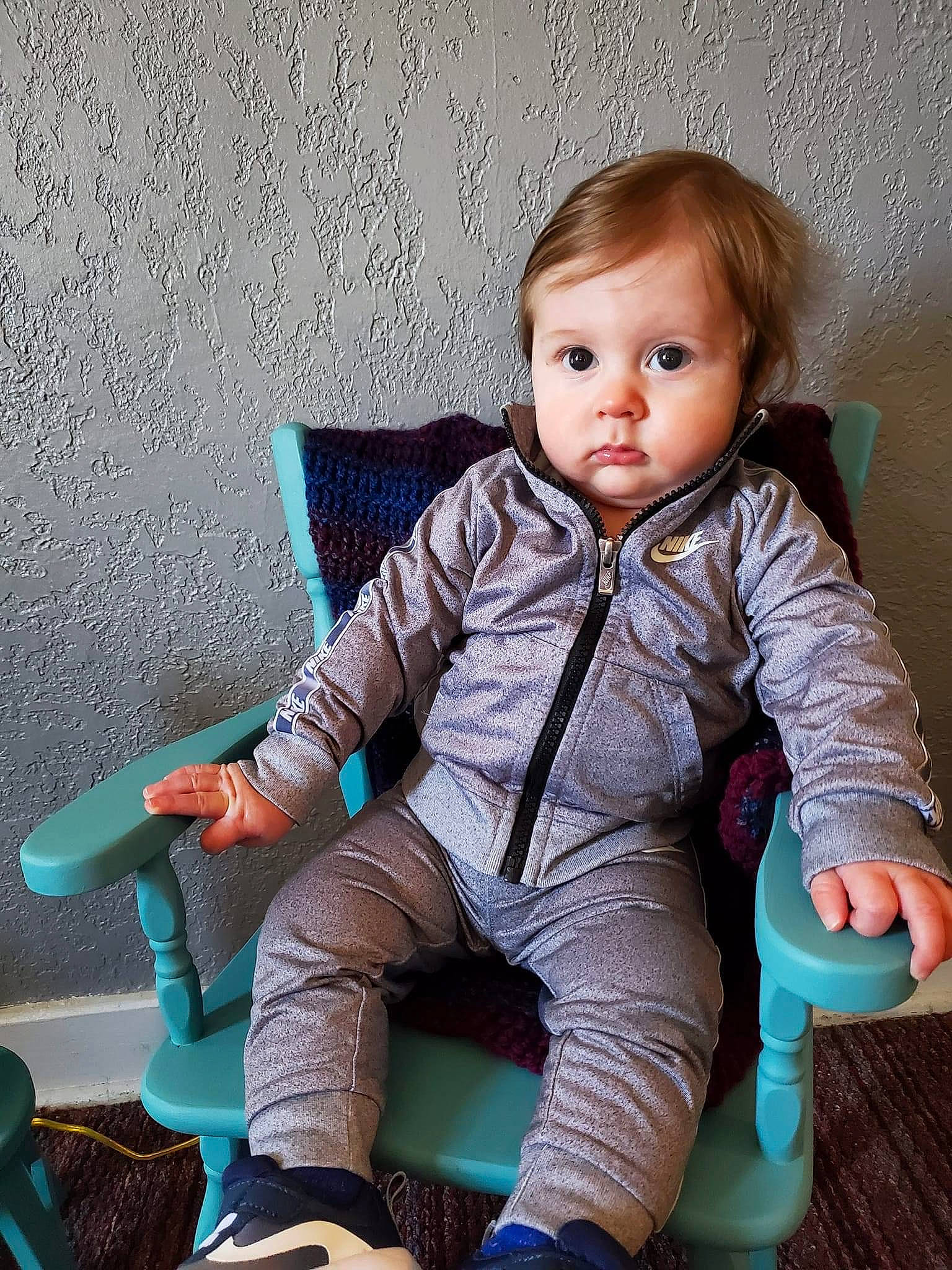 Braylon is registered to the contest to win money with this photo: baby, baby_toddler_clothing, chair, cheek, child, comfort, electric_blue, flash_photography, fun, human_body, human_leg, joint, knee, leg, person, sitting, skin, sleeve, sock, thigh