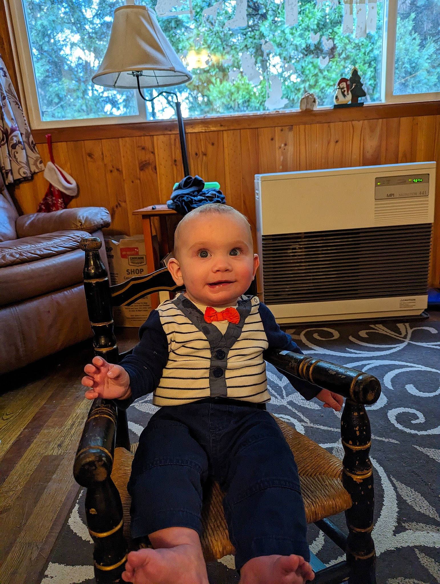 Westley is registered to the contest to win money with this photo: baby, baby_carriage, baby_products, child, couch, flooring, fun, joy, lamp, leg, leisure, person, picture_frame, room, shoe, sitting, smile, sneakers, toddler, wheel