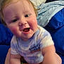Giovanni is registered to the contest to win money with this photo: baby, child, smiling, blue_background, toy, close_up, infant, cute, playful, person, indoors, soft_toy, crawling, happy, face, clothing, short_sleeves, skin, light_hair, cheeks