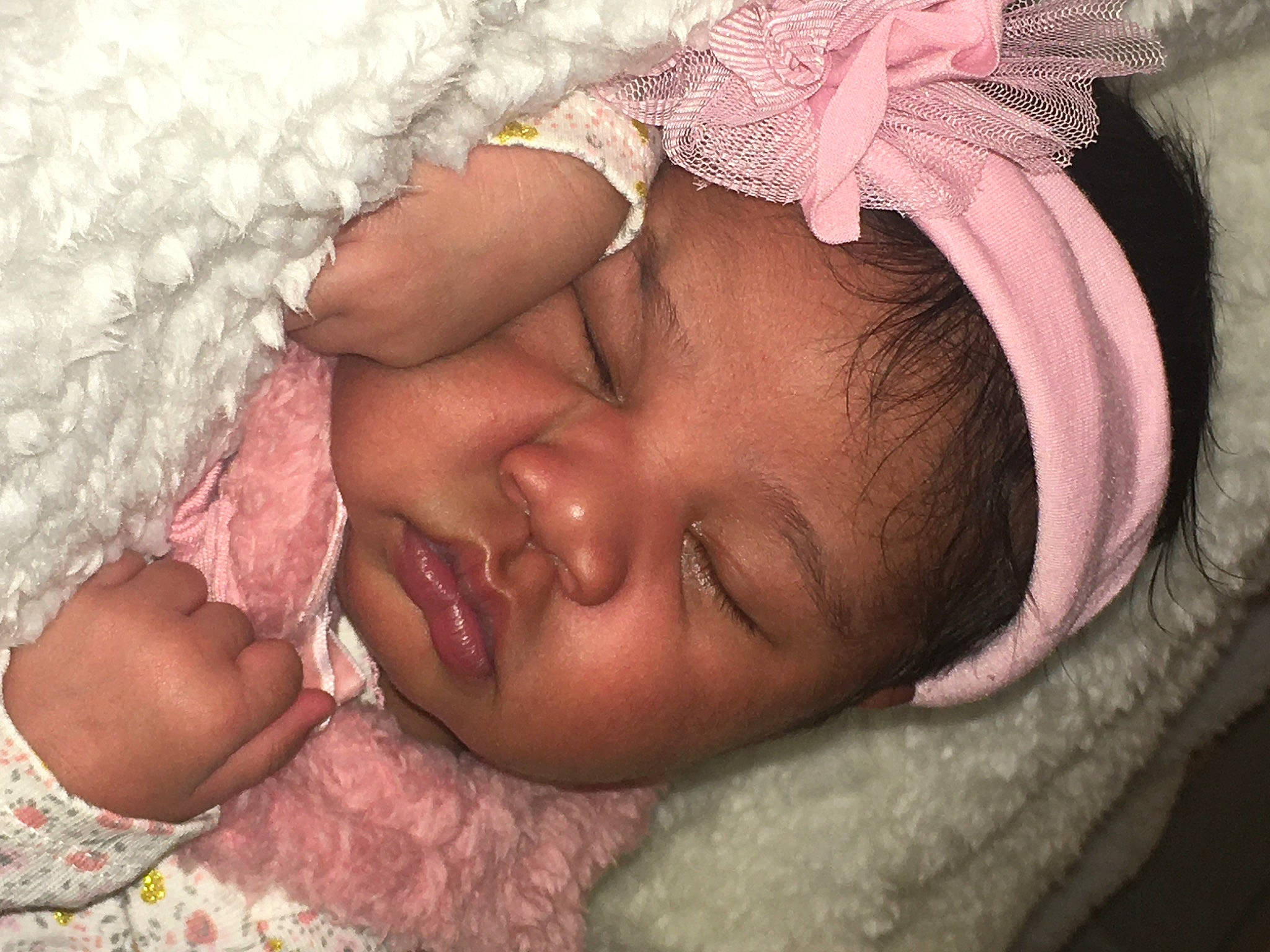 Melady is registered to the contest to win money with this photo: baby, baby_sleeping, cheek, child, close_up, eye, face, hair_accessory, hand, head, headgear, iris, lip, mouth, nose, person, photography, pink, skin, sleep