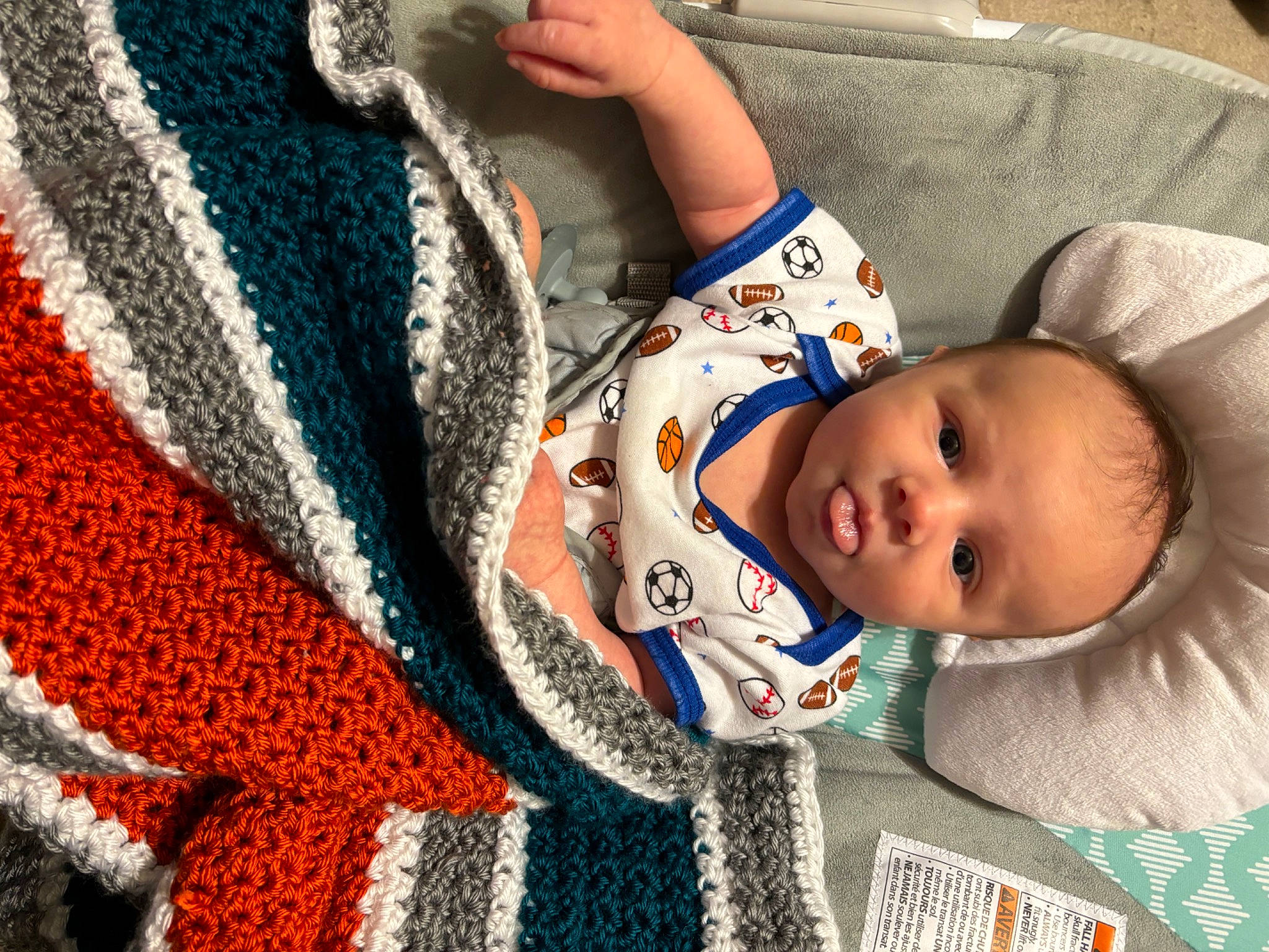 Bradley is registered to the contest to win money with this photo: baby, baby_products, baby_safety, baby_toddler_clothing, cheek, child, comfort, electric_blue, fashion_accessory, headgear, linens, pattern, people, person, room, shawl, textile, toddler, wool, woolen
